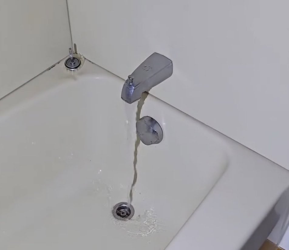 Bathtub faucet and water flow checked during a home inspection