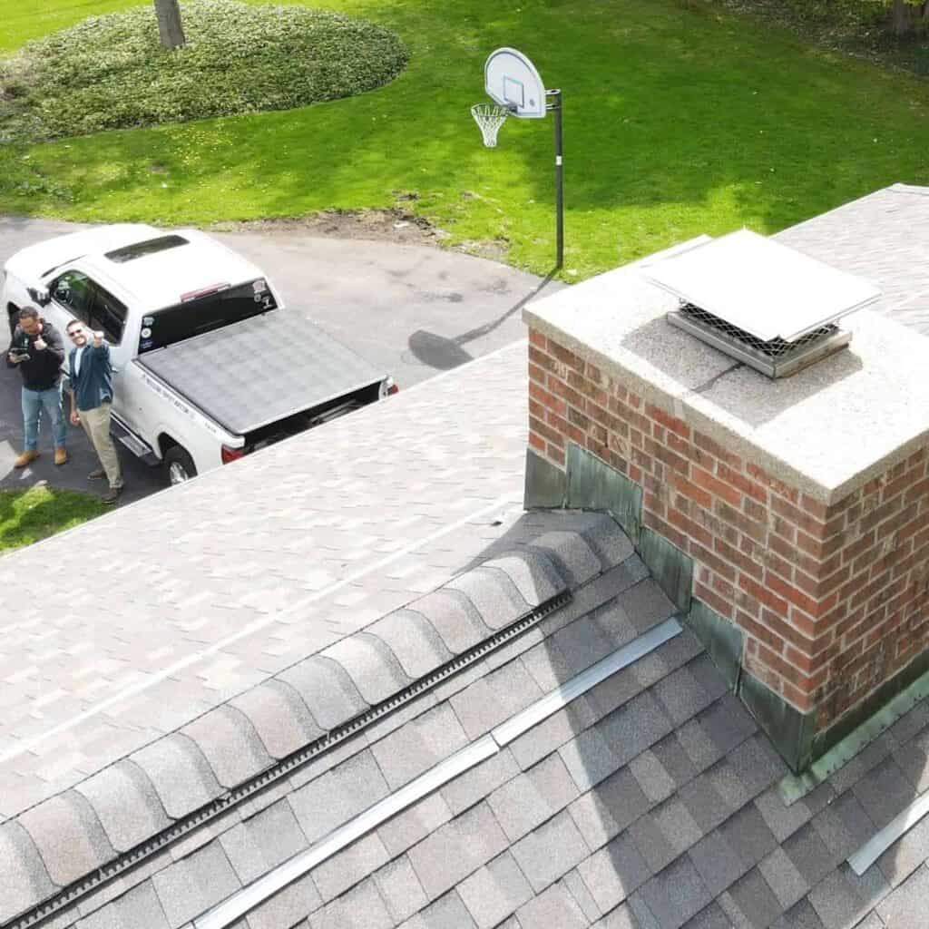 Roof shingles, flashing, and chimney evaluated during a home inspection